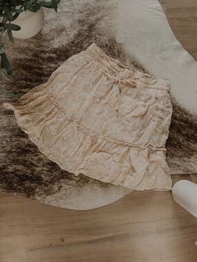 Crescent Cream Mini Skirt with Subtle Floral Print